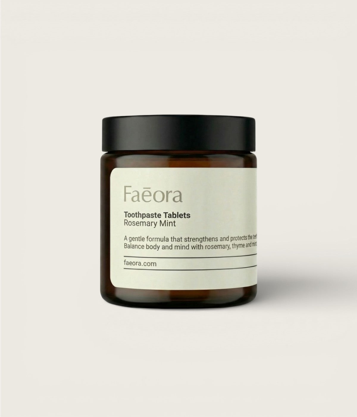Rosemary Mint jar of Faeora toothpaste tablets on a light gray background.